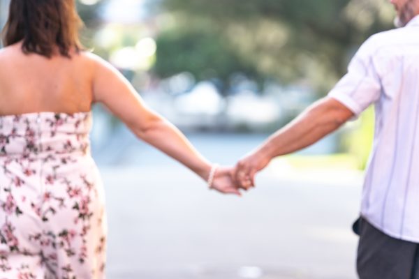 A stock photo of a couple holding hands